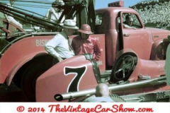 race-car-at-the-race-track-with-wrecker-truck-1950s