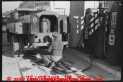 gasoline-truck-driver-getting-ready-to-fill-service-stations-tan-2